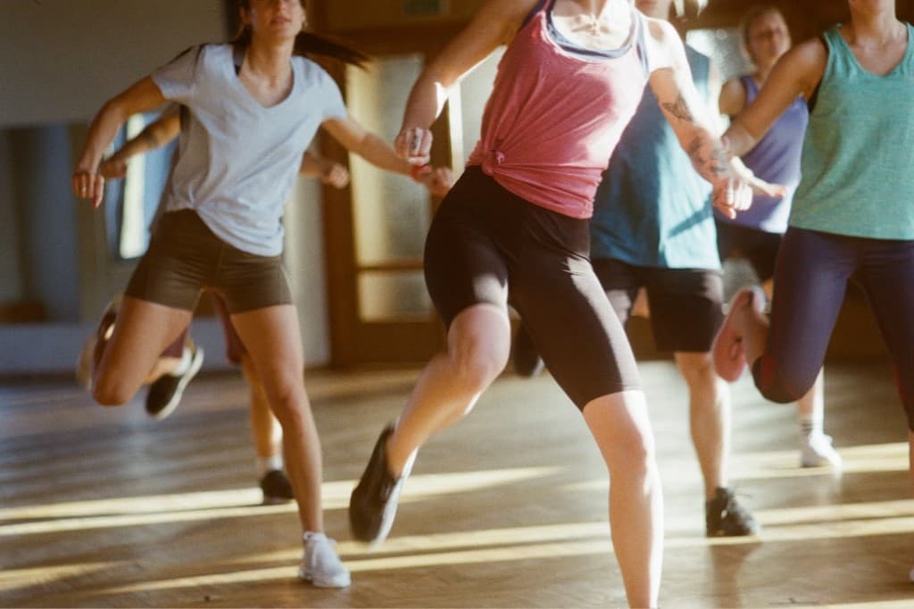 Group dance class in a sunlit venue