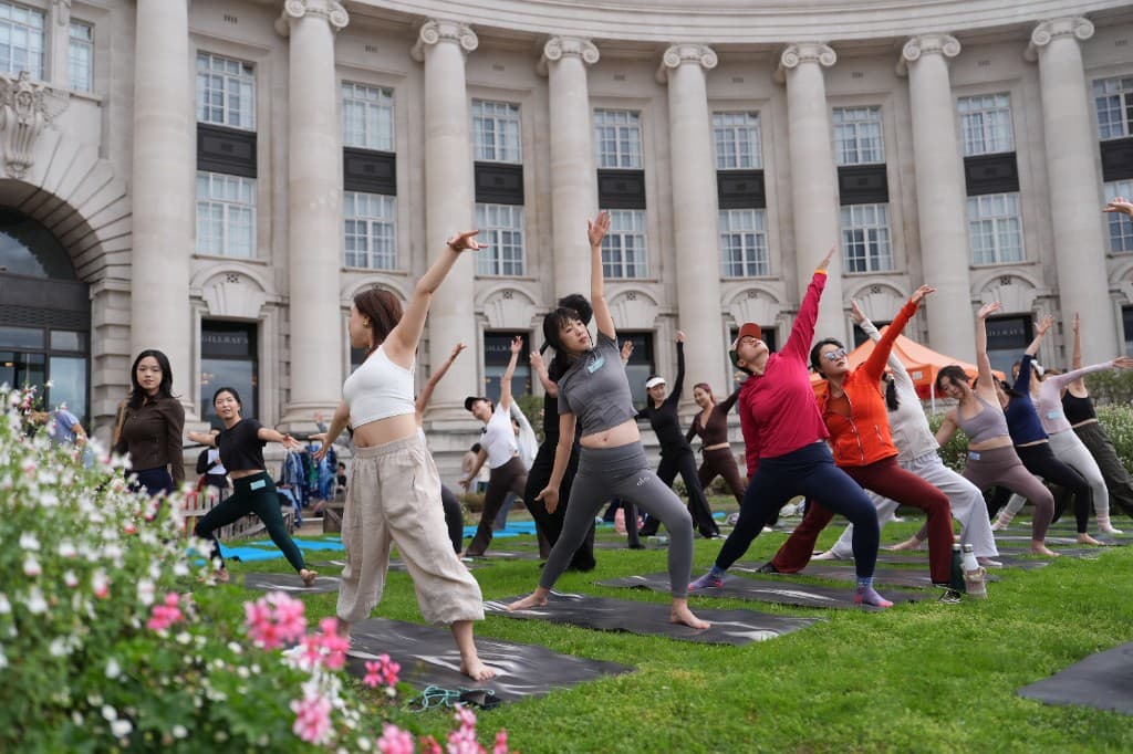 Outdoor yoga session on the lawn at County Hall during the Chinese Yoga Festival